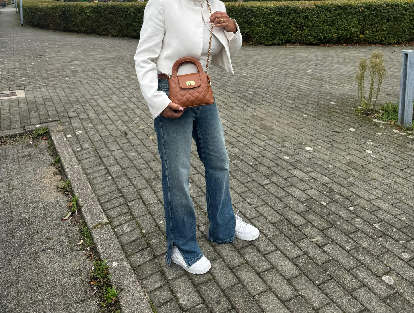 Leren handtas met goudkleurige draaisluiting