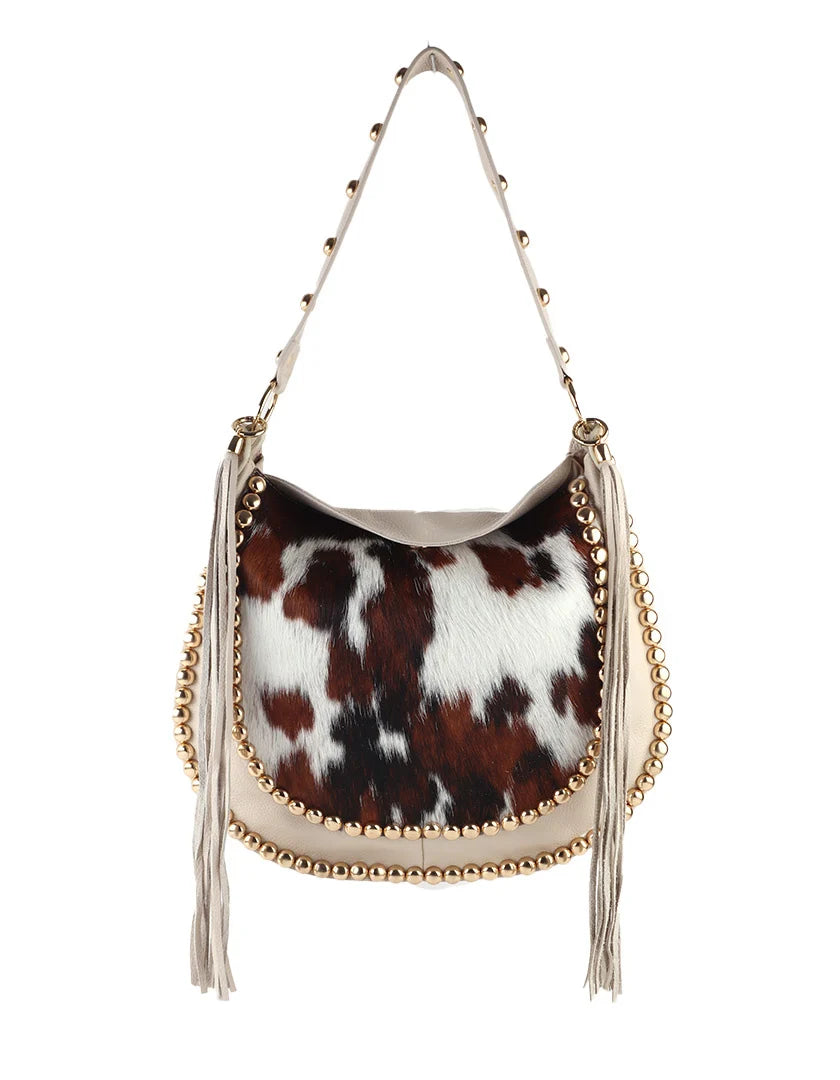 Lederen western hobo-tas met studs, franjes en luxe koeienhuidlook.